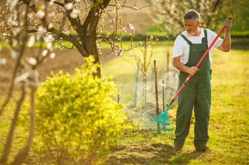 Worker wearing protective equipment during garden maintenance